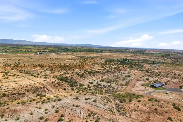 Expansive desert landscape with scattered green vegetation