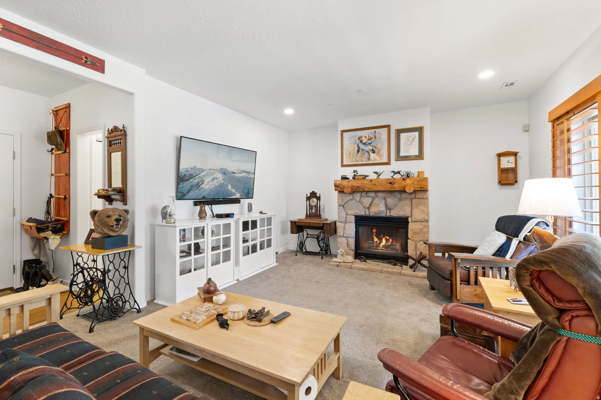 Stone fireplace with a log mantle