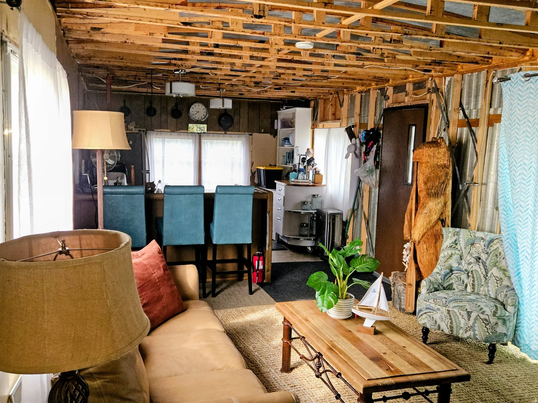 Exposed wood ceiling beams and corrugated wall panels