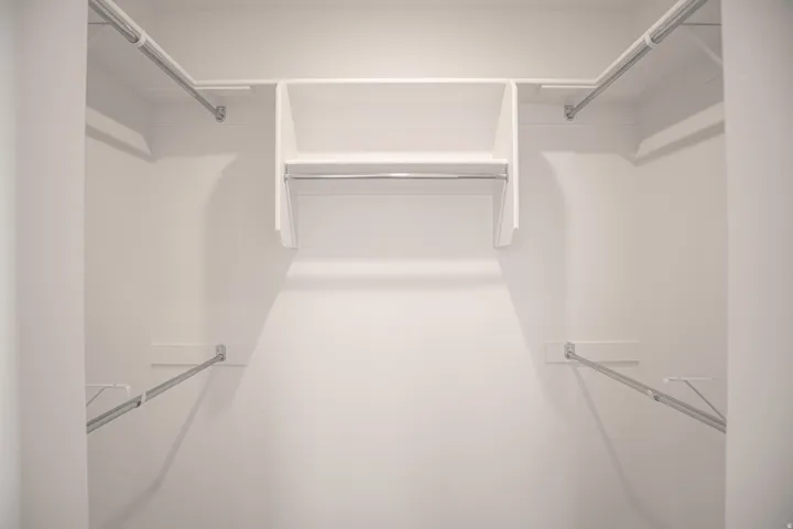 Primary bedroom walk-in closet