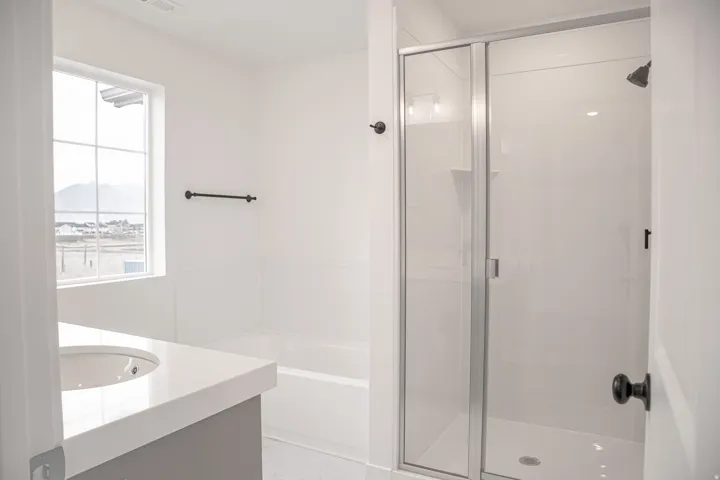 Primary bathroom with separate tub and shower