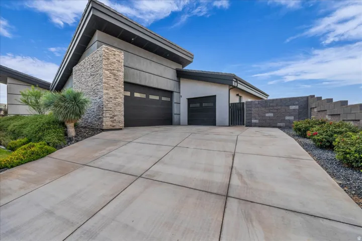 Modern exterior with stone accents and a sloped roofline