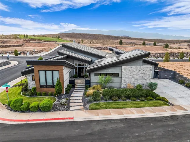 Modern architectural design featuring a multi-level flat roofline and integrated landscaping