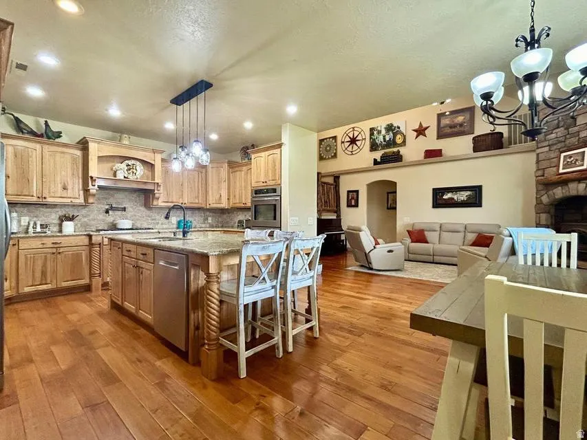 Open-concept living space with wood-finish flooring