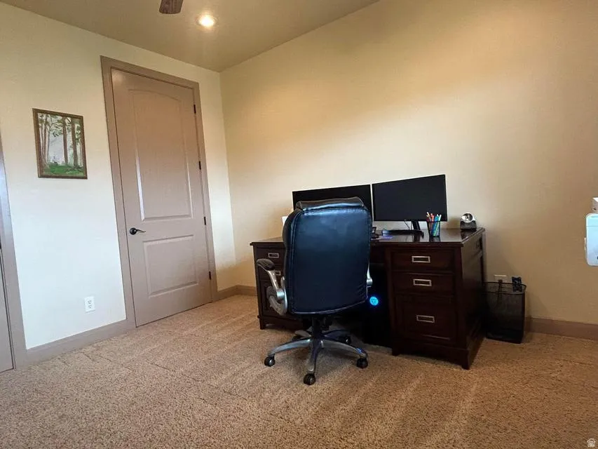 Carpeting throughout with neutral wall paint and contrasting trim
