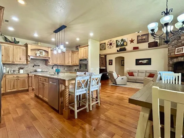 Open-concept living space with wood-finish flooring