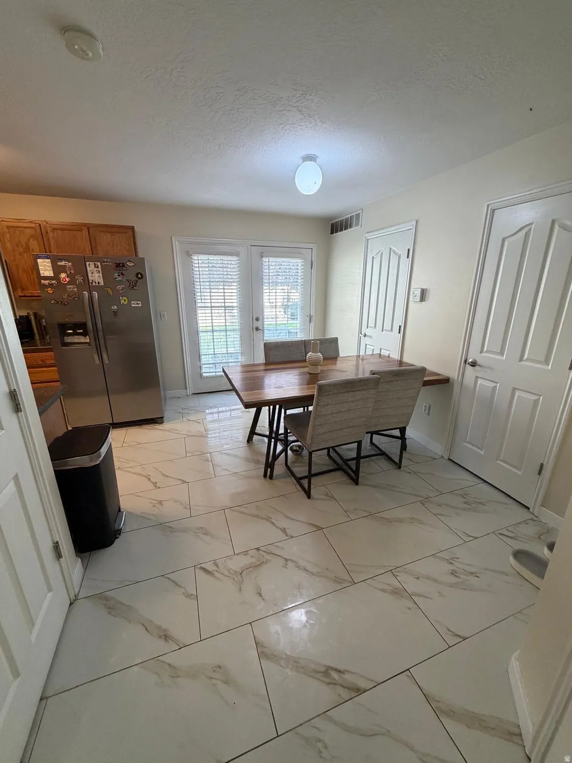 White tile flooring with grey veining