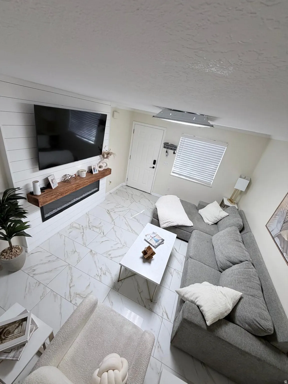 White tile flooring with a marble-effect pattern