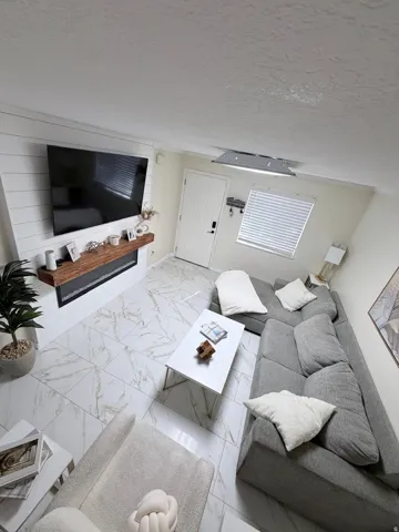 White tile flooring with a marble-effect pattern