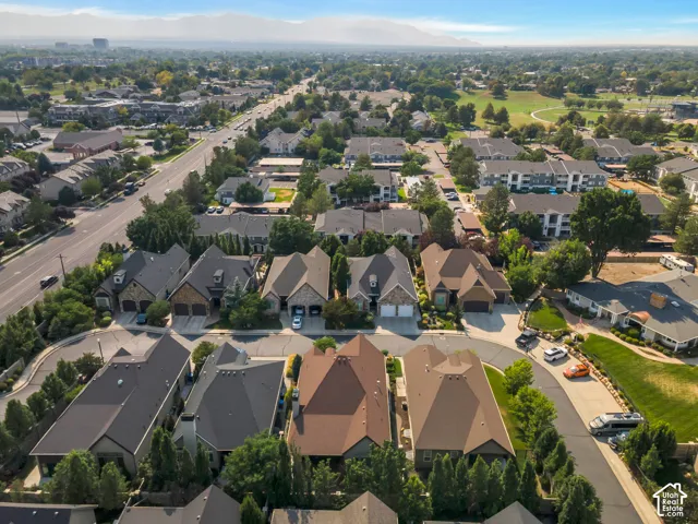 Residential neighborhood featuring varied architectural styles, mature landscaping, and a street network