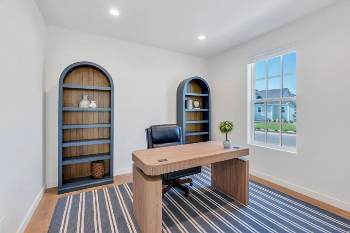 Recessed lighting, wood-finish flooring, and a multi-pane window