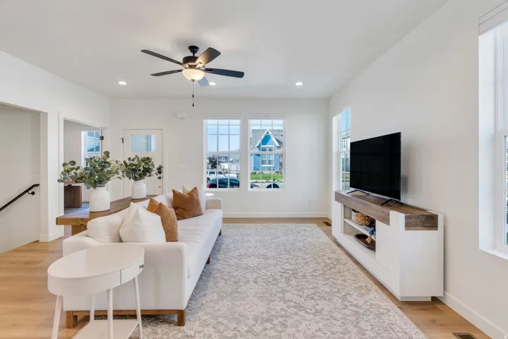Recessed lighting, wood-finish flooring, and multiple windows