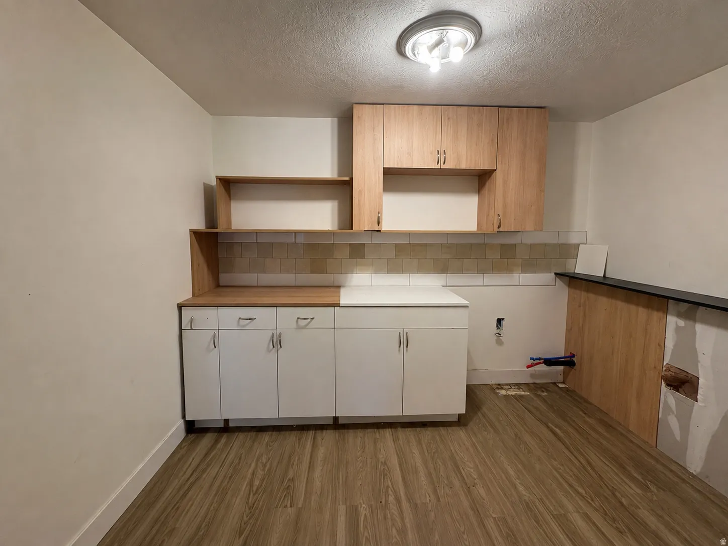 Basement closet/storage/ with rough in plumbing for kitchen