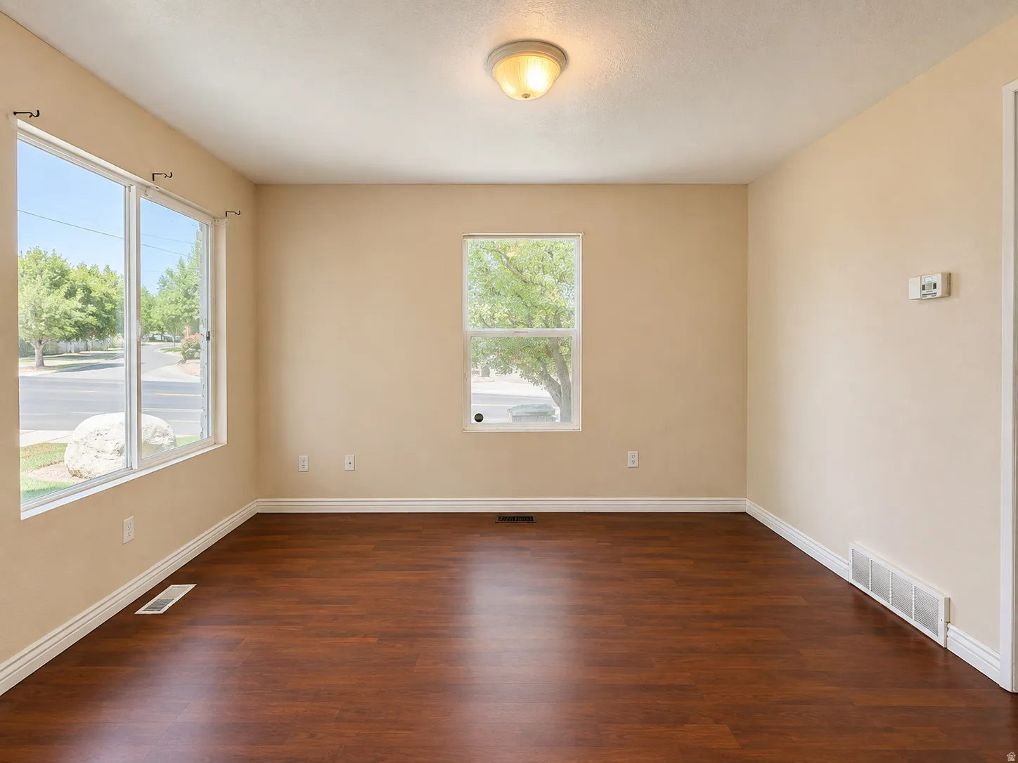 Wood-finish flooring throughout, complemented by light-toned wall paint