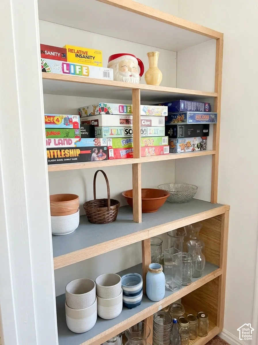 Custom built-in shelving with light wood-finish framing and contrasting shelf surfaces