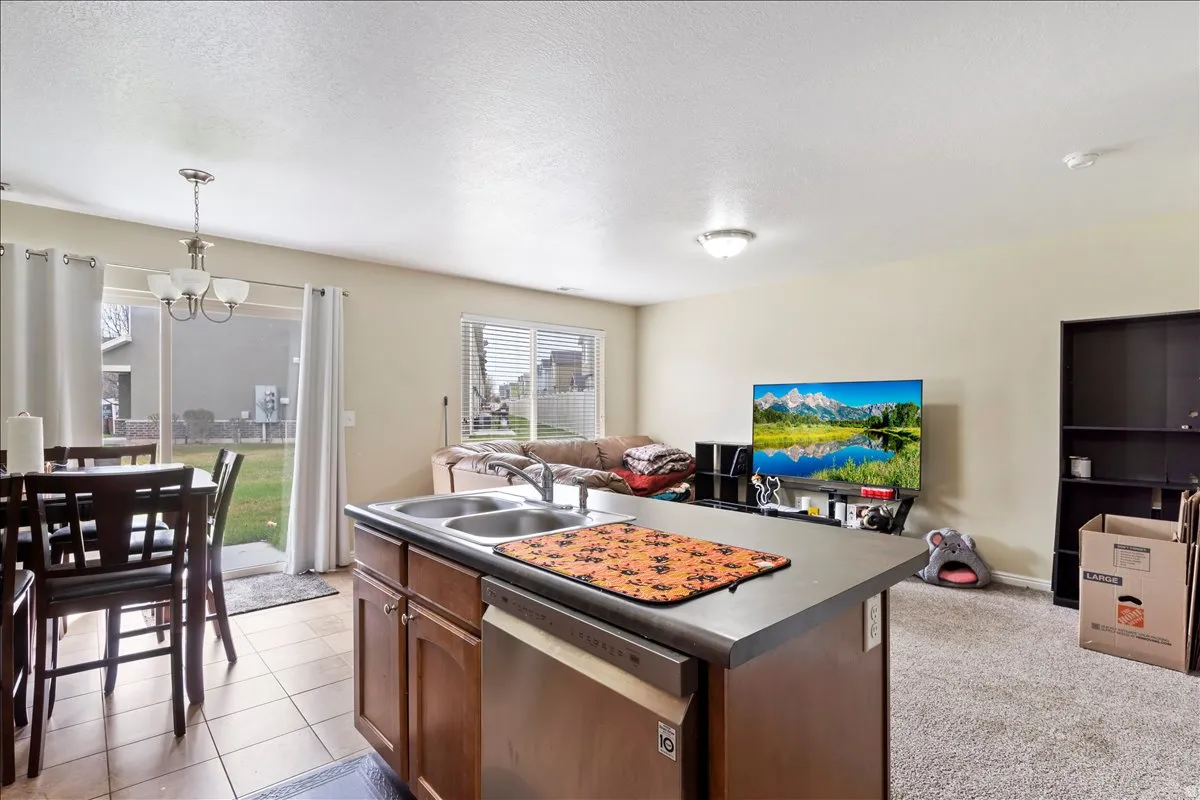 Kitchen island with dual stainless steel sinks and integrated dishwasher