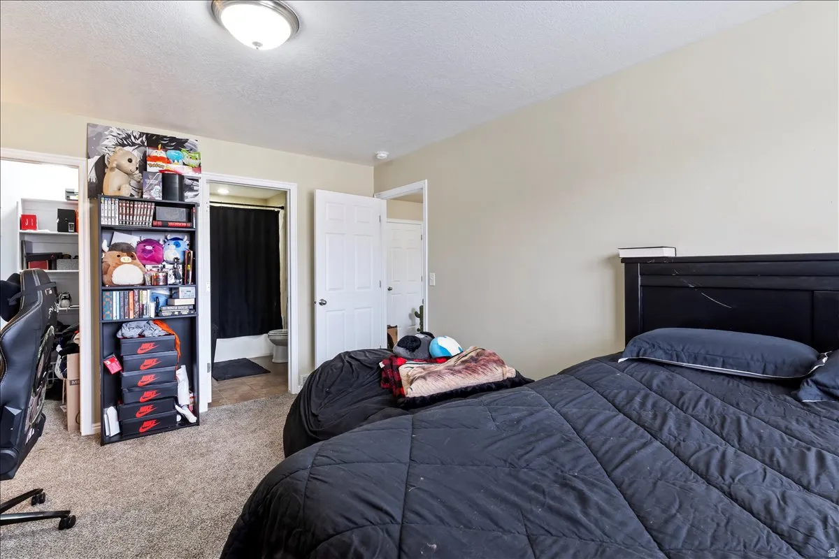 Neutral-toned walls with ceiling-mounted lighting