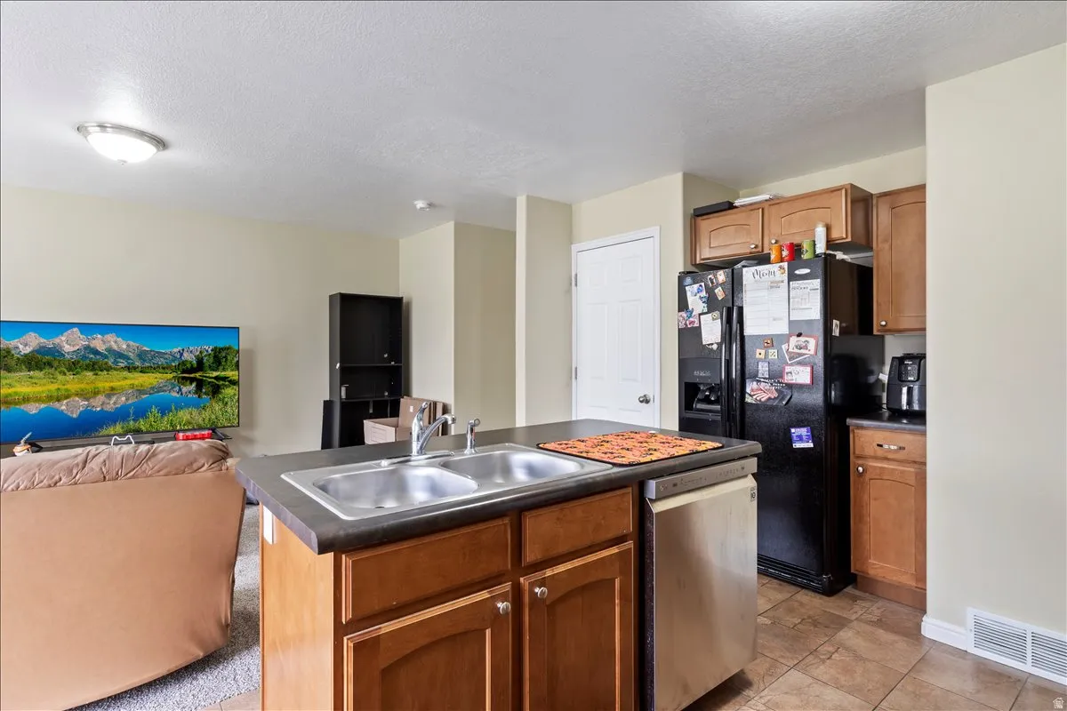Kitchen island with a double basin stainless steel sink