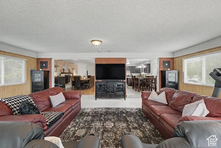 Great room is open to formal dining room and kitchen area.