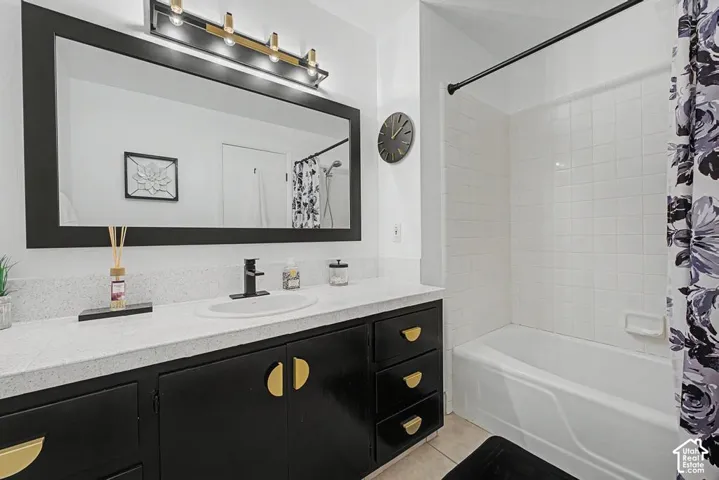 Main hall bath features a bathtub with tile surround.