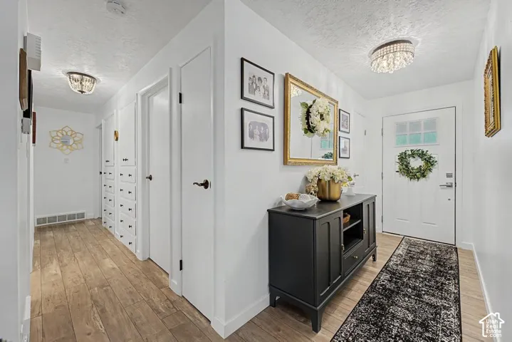 Looking at front entry and hallway to bedrooms