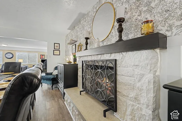 Beautifully updated fireplace and decorative wall behind.