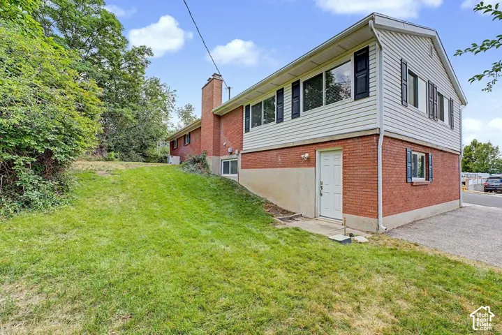 West side of backyard. Man door leads from garage to backyard.
