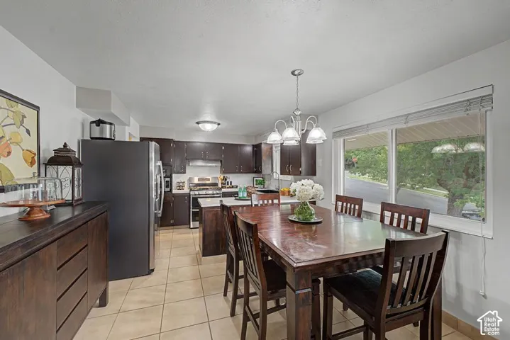 Tile flooring extending from semi-formal dining to kitchen space