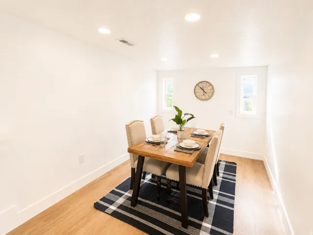 Wood-finish flooring, recessed lighting, and dual windows