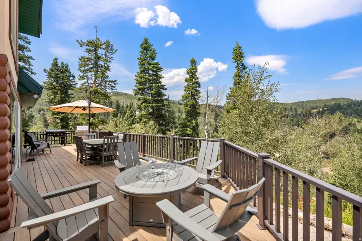 Expansive outdoor deck with wood-finish flooring and a protective railing