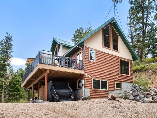 Wood-sided exterior with a natural stone foundation