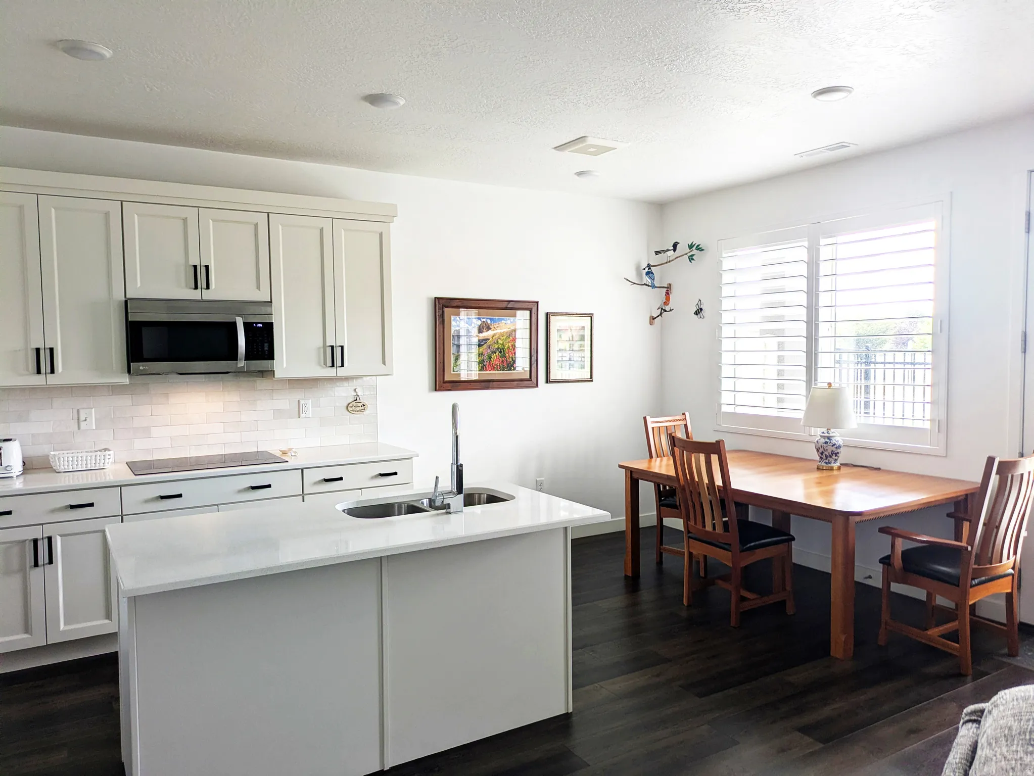 White shaker cabinetry with matte black hardware