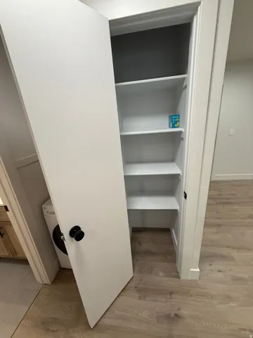 Built-in shelving and wood-finish flooring
