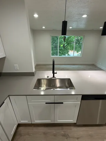 Stainless steel undermount sink with a matte black faucet