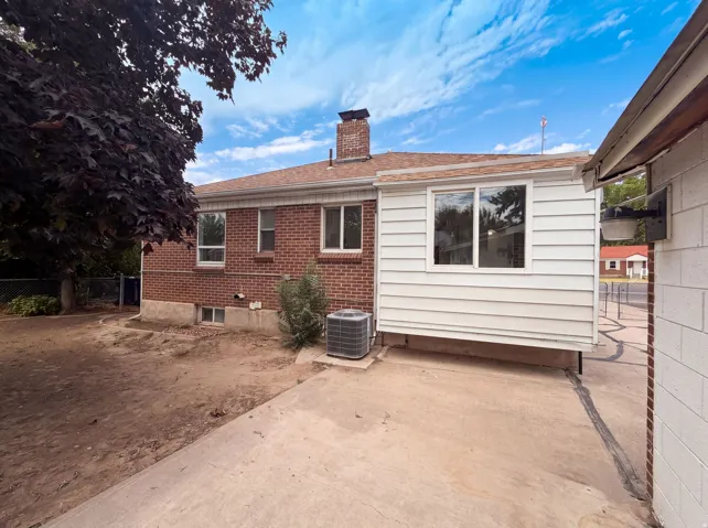 Brick exterior with white siding addition