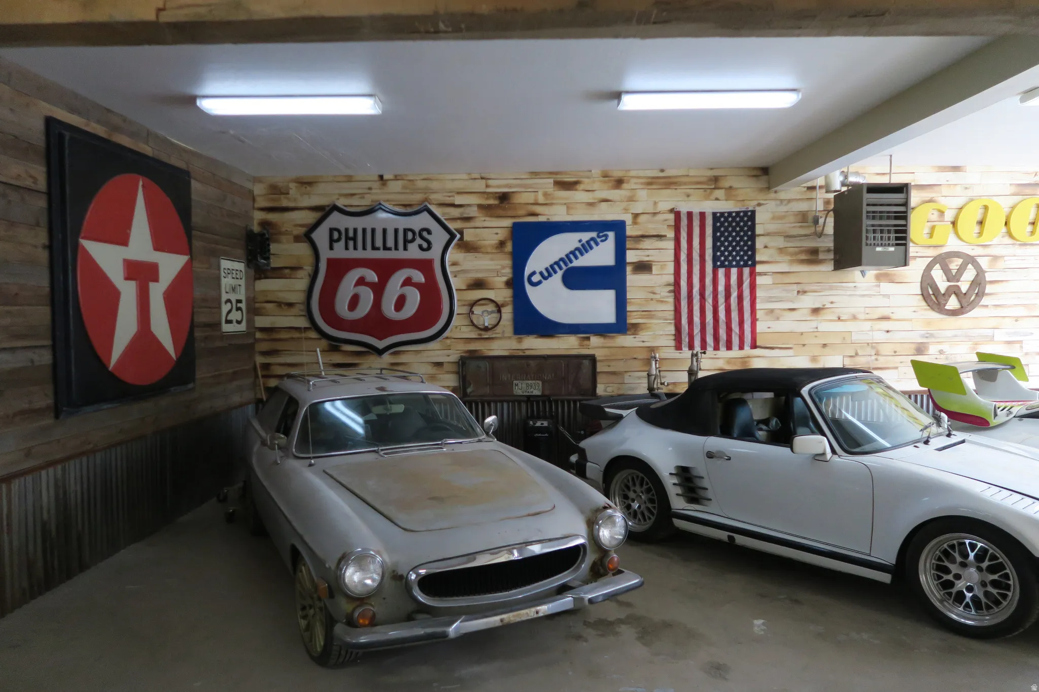 Interior space featuring wood-paneled walls and a corrugated metal wainscoting
