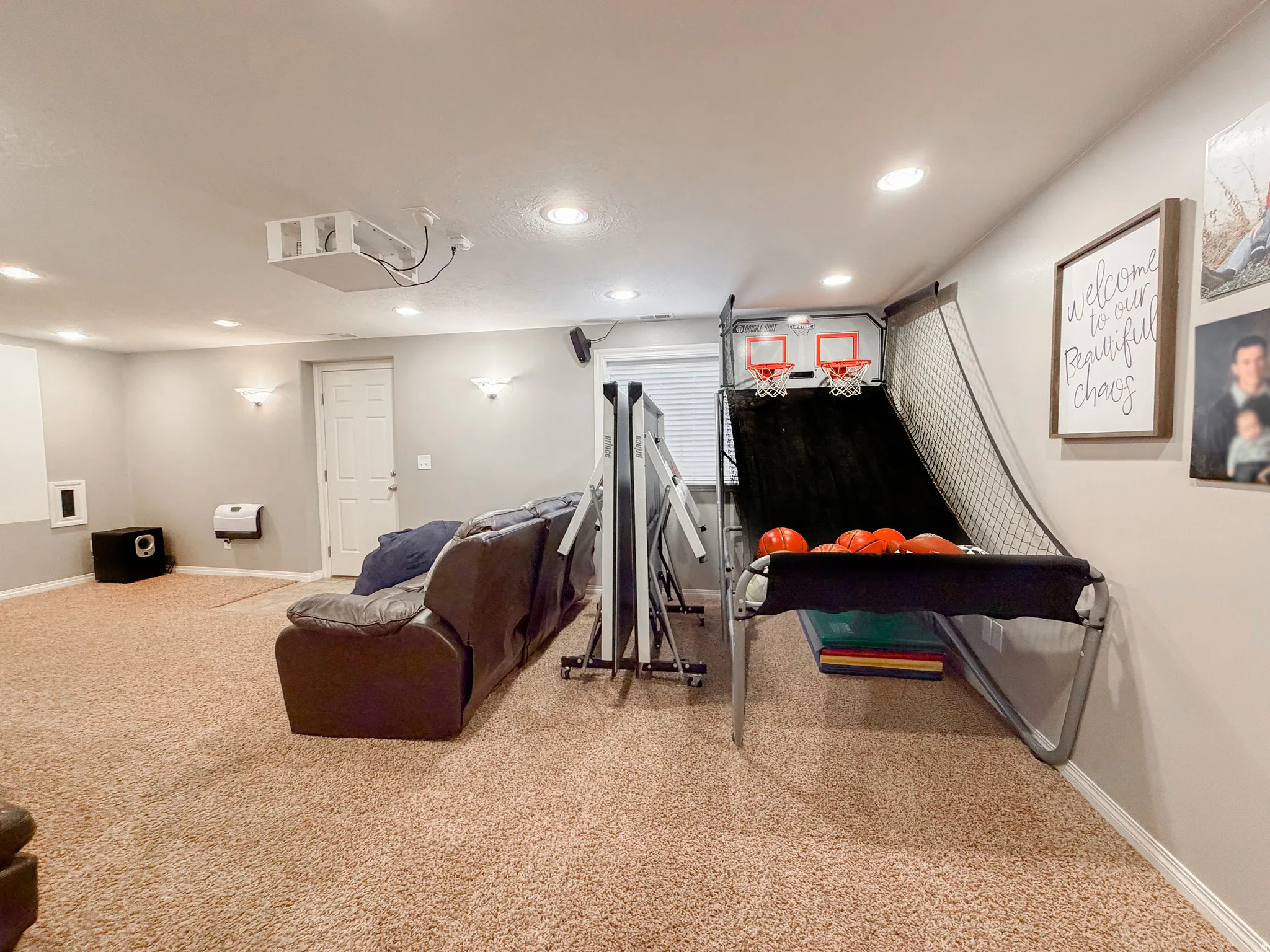 Recessed lighting throughout, ceiling-mounted projector, and carpeted flooring