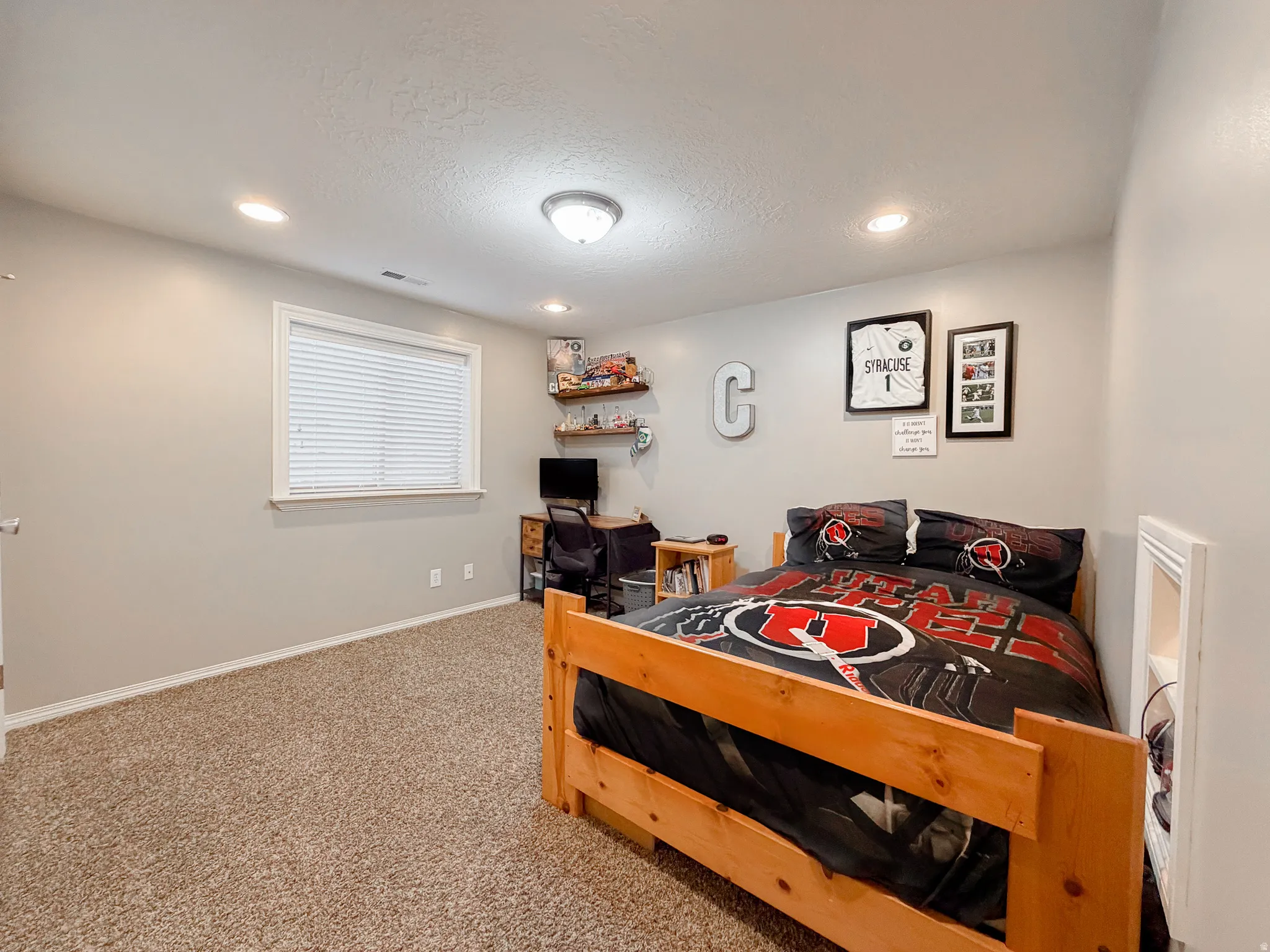 Carpeted room with recessed lighting and a flush mount ceiling fixture
