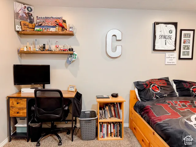Two floating wood shelves on a light-colored wall