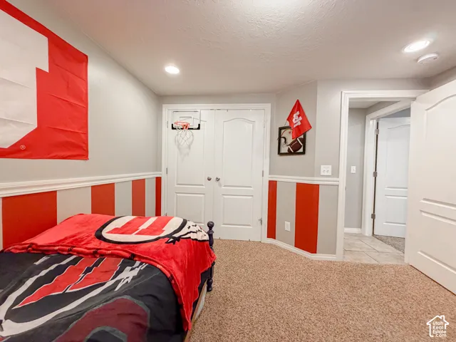 Recessed ceiling lighting, textured carpeting, panel doors, and wainscoting