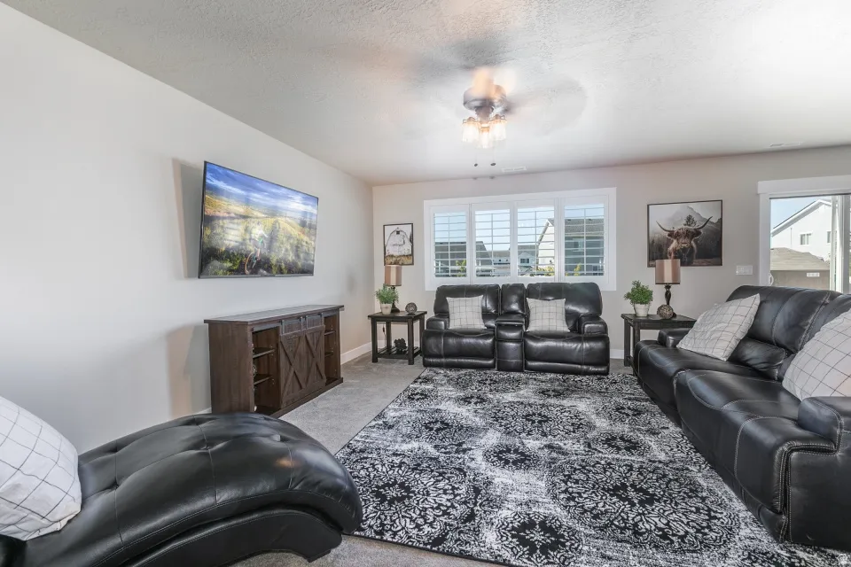 Recessed lighting, ceiling fan, carpeted flooring, window with shutters, and sliding glass door