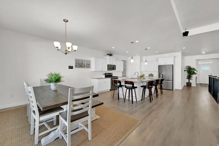 Open-concept living area with wood-finish flooring