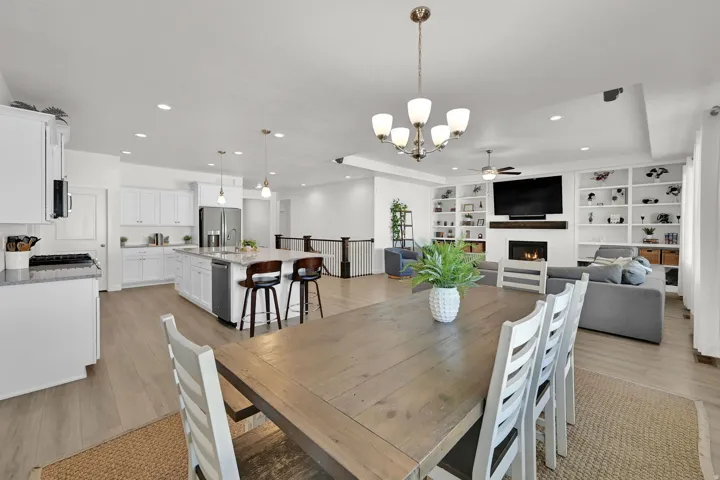 Open-concept living area with wood-finish flooring