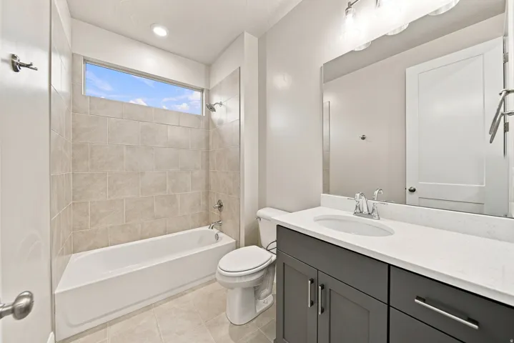 Tub/shower combination with full-height tile surround