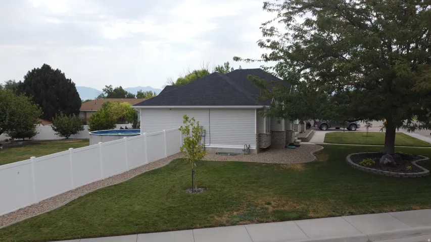 White vinyl privacy fencing enclosing the backyard