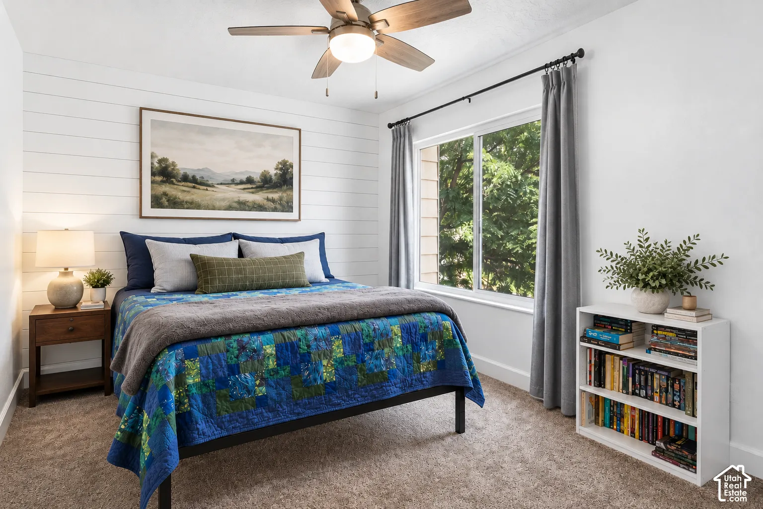 White shiplap accent wall, wood-finish ceiling fan, added digital staging pieces