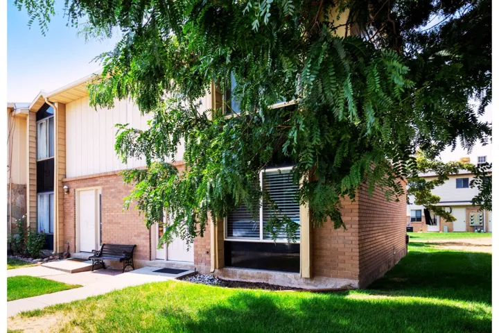 Brick and siding exterior with mature trees
