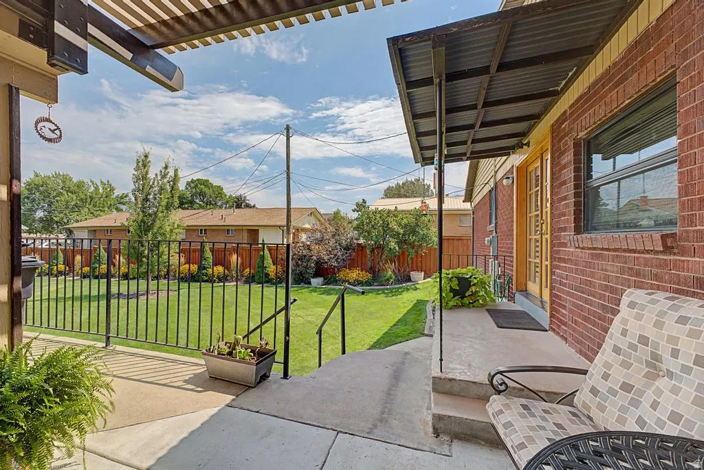 Red brick exterior with a corrugated metal awning
