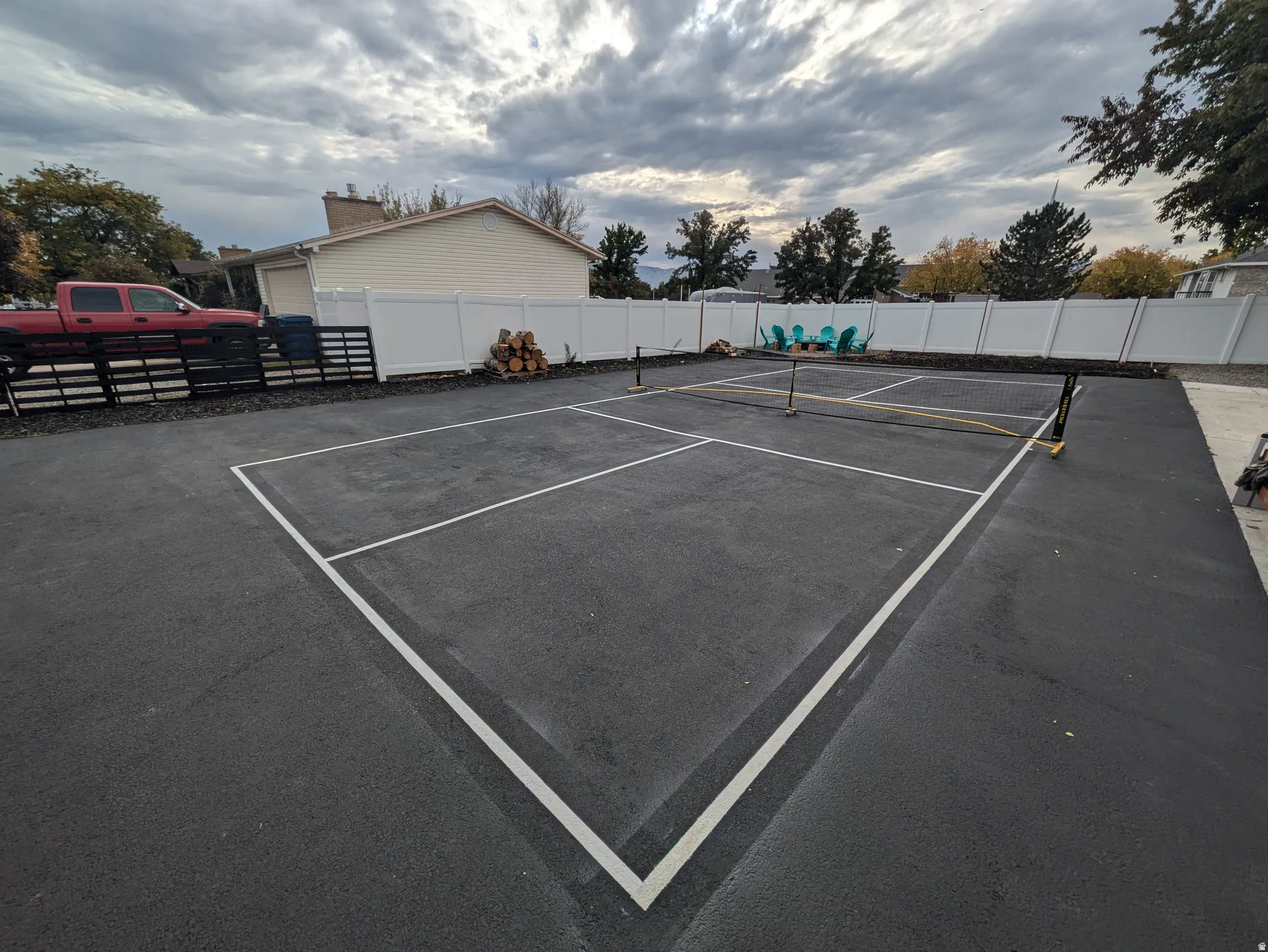Dedicated recreational court with professional-grade markings and durable asphalt surface