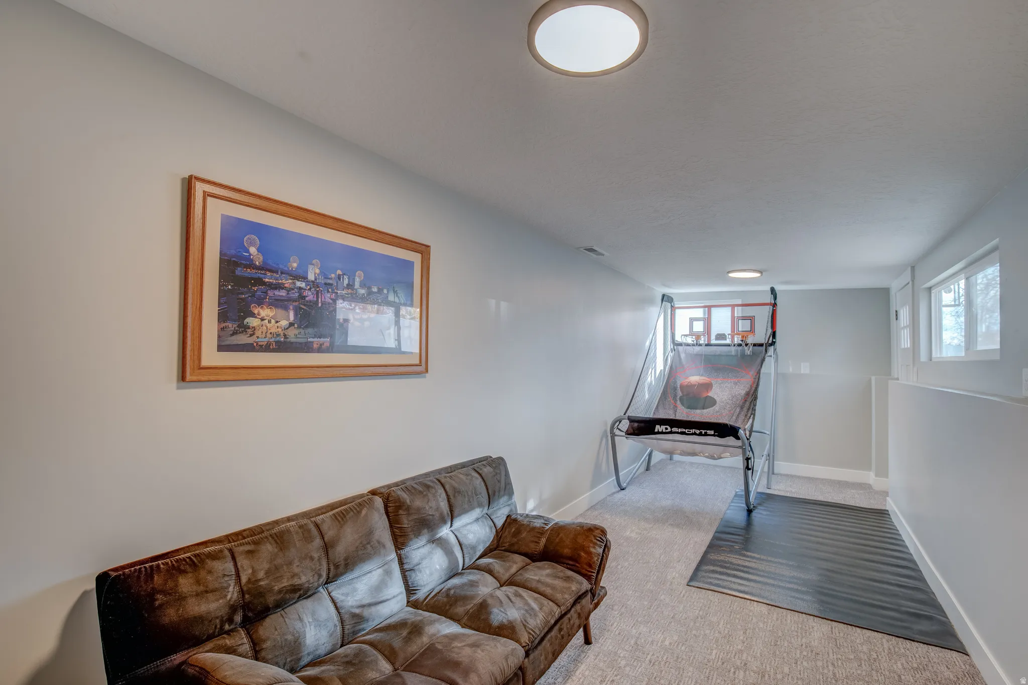 Recessed windows with trim, light gray painted walls, and light gray carpet